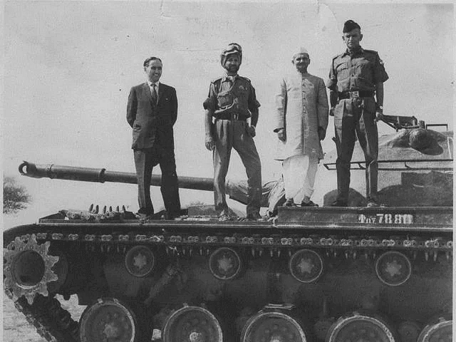 Prime minister Lal Bahadur Shastri and army officers atop a captured Pakistani tank. 