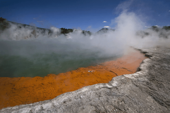 New Zealand`s Champagne Pool is a hot spring that contains a community of thermophilic and acidophilic microorganisms whose distribution relates to the temperature and chemical environment.