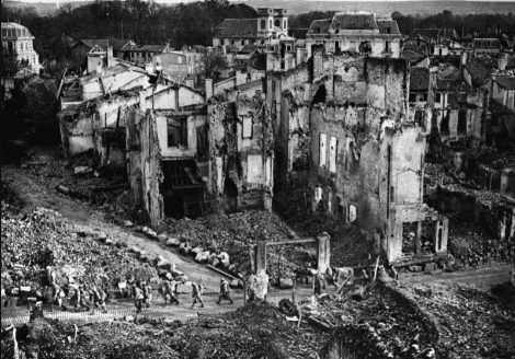 French troops passing though the ruins of Verdun, France, 1916