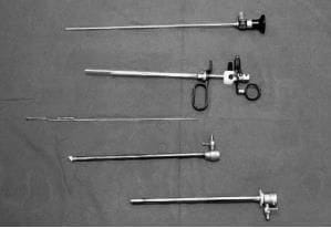 A continuous flow resectoscope with a passive handle mechanism